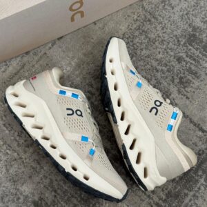 On Cloudsurfer gris con azul