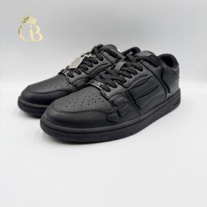 Amiri Skel Negro de Piel